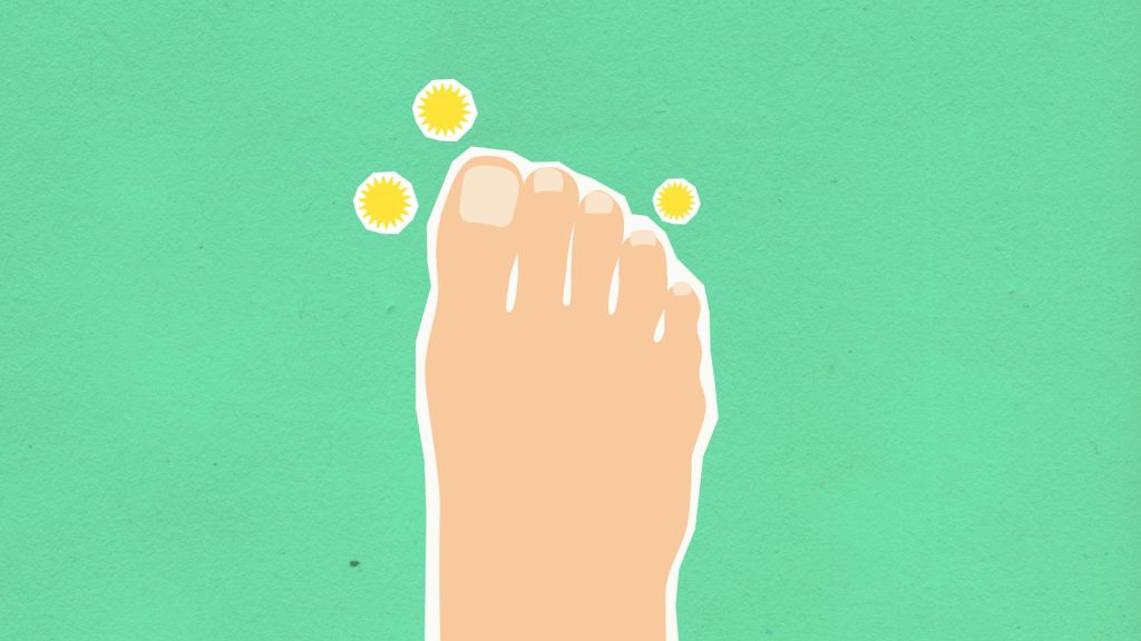 Top view of decorative cardboard illustration representing foot and microbes causing fungal disease on green background